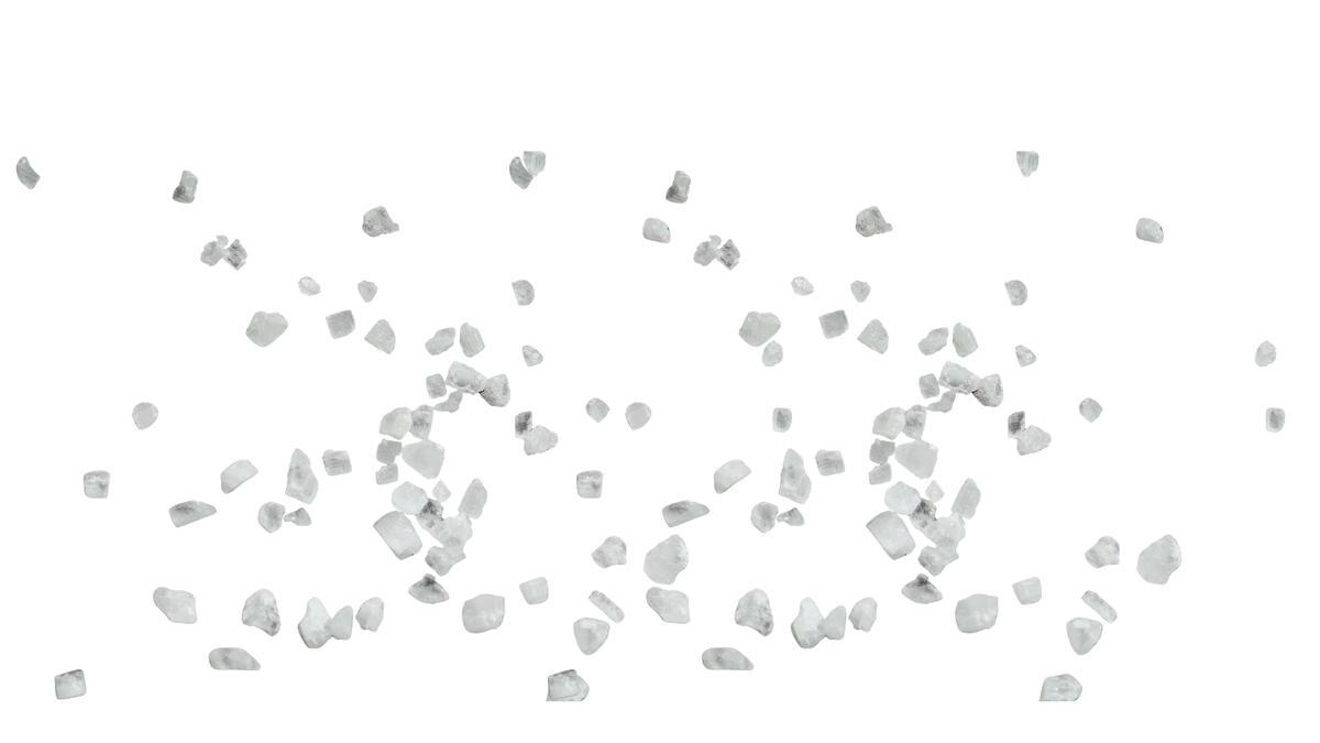 White decorative salt chips scattered across a plain white background.
