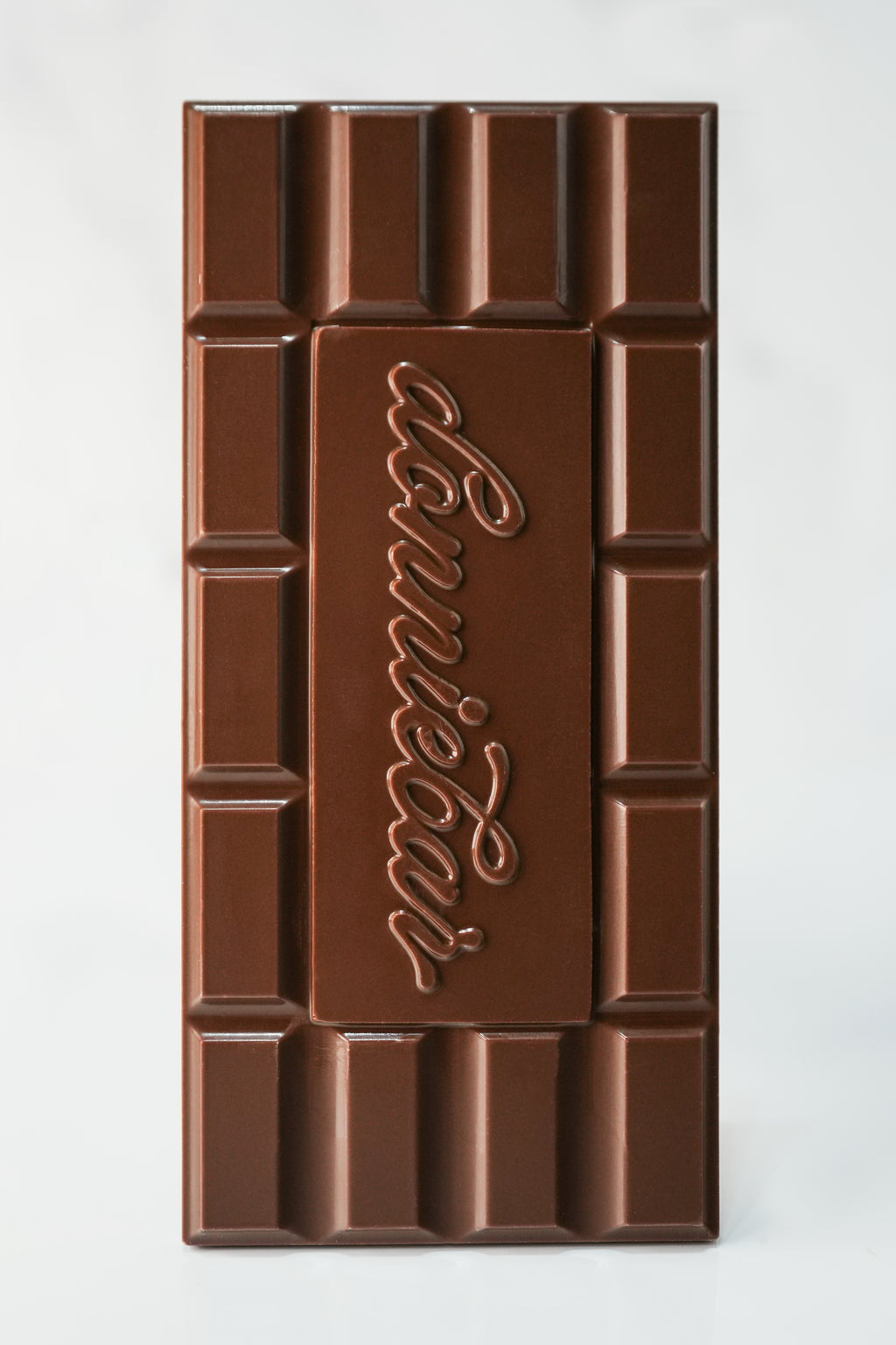 A large chocolate bar with a brick-like segmented design and the brand name 'Donniebar' embossed in the center, shown on a plain light background.