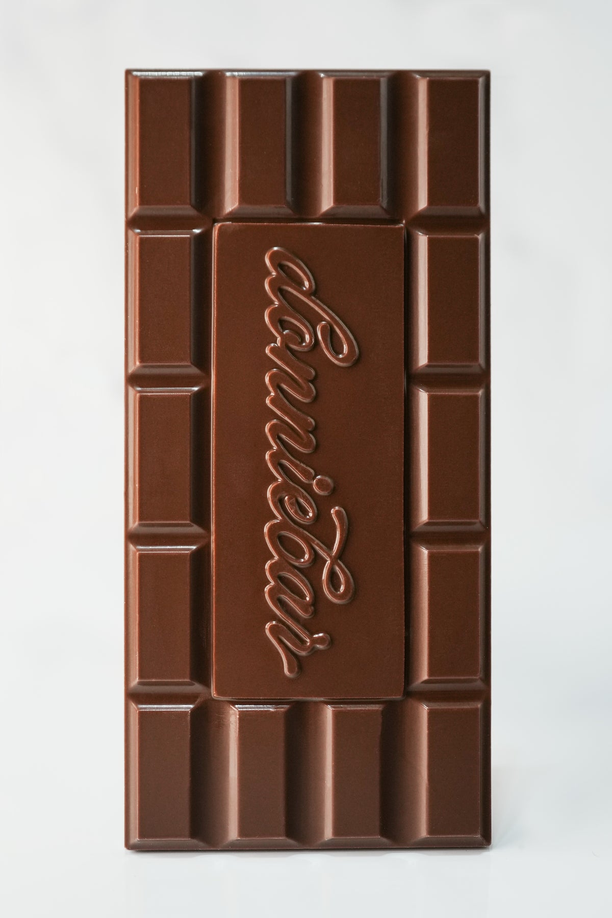 A large chocolate bar with a brick-like segmented design and the brand name 'Donniebar' embossed in the center, shown on a plain light background.